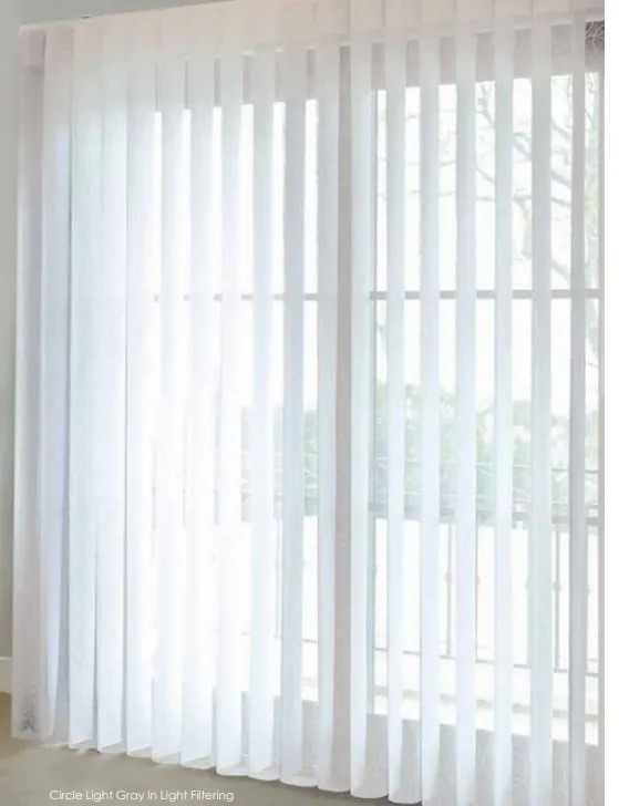 Close-up of light-filtering SmartDrape vanes running the full width of a glass wall
